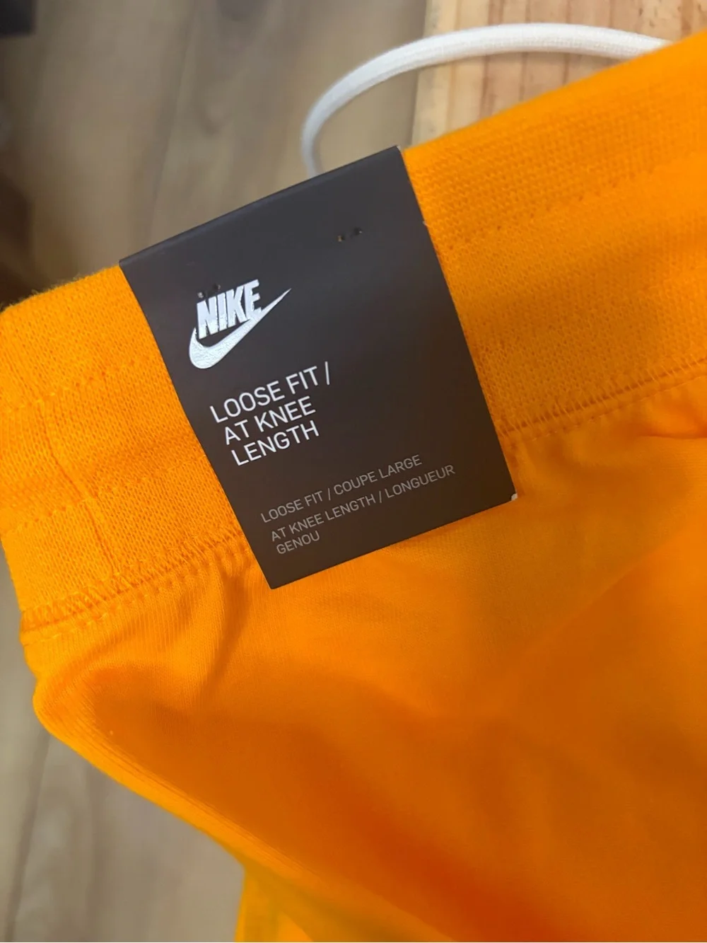 Nike Bright Orange Athletic Shorts with White Swoosh Tag
